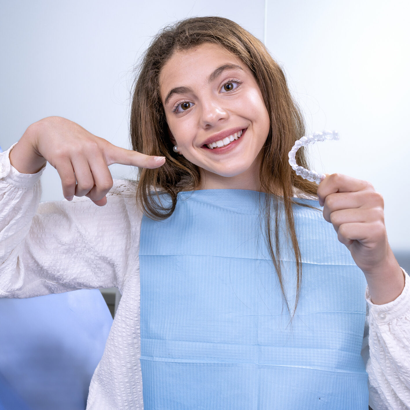 Teenage Girl Goes To The Dentist To Receive Modern Orthodontic Treatment To Correct The Alignment Of Her Teeth