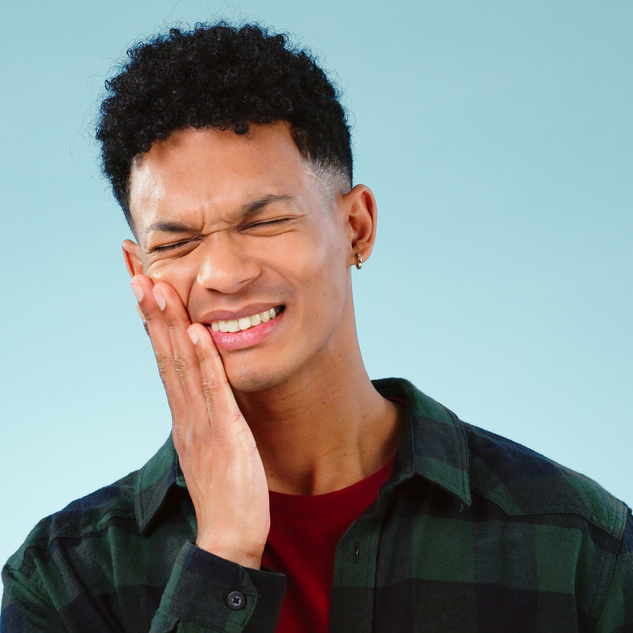 Man, Toothache Or Pain In Studio With Gum Problem, Cavity Or Dental Crisis By Blue Background. Model, Face And Hands By Teeth Care For Tmj, Gingivitis And Oral Decay Or Orthodontics Help In Mockup